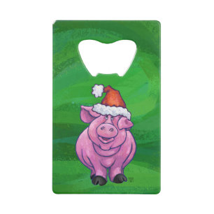 Feierliches Schwein in Weihnachtsmannmütze auf Grü Kreditkartenflaschenöffner