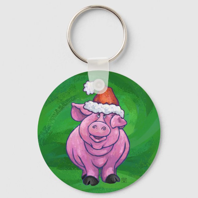 Feierliches Schwein in Weihnachtsmannmütze auf Grü Schlüsselanhänger (Vorderseite)