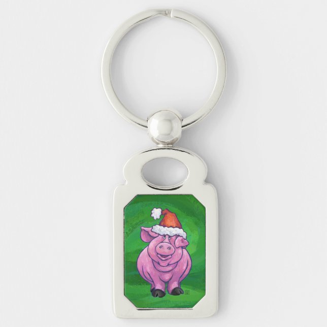 Feierliches Schwein in Weihnachtsmannmütze auf Grü Schlüsselanhänger (Vorderseite)