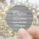 Feiern jedes Jahr Geburtstagsparty Gray Wood Rusti Runder Aufkleber<br><div class="desc">Fügen Sie eine personalisierte Touch zu Geburtstagsparty Einladungen und Favoriten mit diesen stilvollen Imitaten graue Holzrundkleber / Umschlag Aufkleber. Design bietet moderne Skriptkalligraphie bearbeitbare "Cheers to 30 Years" auf einem rustikalen grauen Holz-Hintergrund. Diese Vorlage ist für eine 30. Geburtstagsfeier Set, aber es ist einfach, um ein anderes Jahr oder Alter....</div>