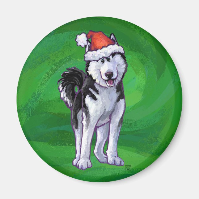 Feiernder Husky in Weihnachtsmannmütze auf Green Magnet (Vorne)