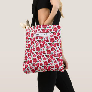 Feminines Muster aus lebendigen roten Rosen mit in Tasche