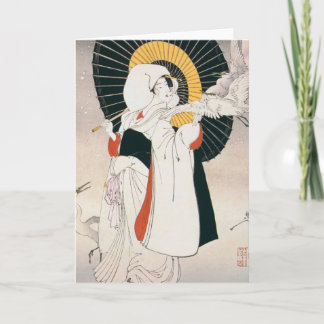 Femme japonaise avec la carte de voeux de