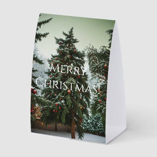 Festive fir trees decorated with garlands tischaufsteller