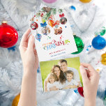 Festive Merry Christmas Pine & Baubles 4 Photo All In One Einladung<br><div class="desc">This is a bright, colorful and unique holiday greeting featuring four festive Christmas ornament-shaped photo templates hanging from a watercolor pine branch. Also featured is a cheery multicolored Merry Christmas text graphic in a custom decorative font. Includes editable text fields. The panels feature editable text fields, complementary Happy Holidays and...</div>
