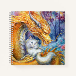Feuerdrache und weiße Katze im mystischen Wald Notizbuch