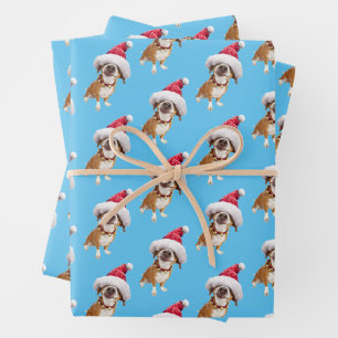 Feuille De Papier Cadeau Chien avec un grand chapeau de Père Noël