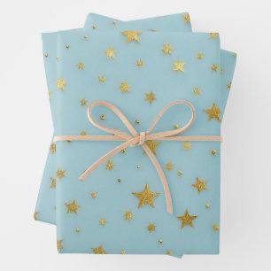 Feuille De Papier Cadeau Etoiles d'or et perles sur Arrière - plan bleu cla