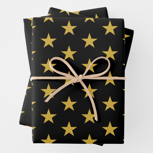 Feuille De Papier Cadeau Étoiles d'or sur noir (En situation)