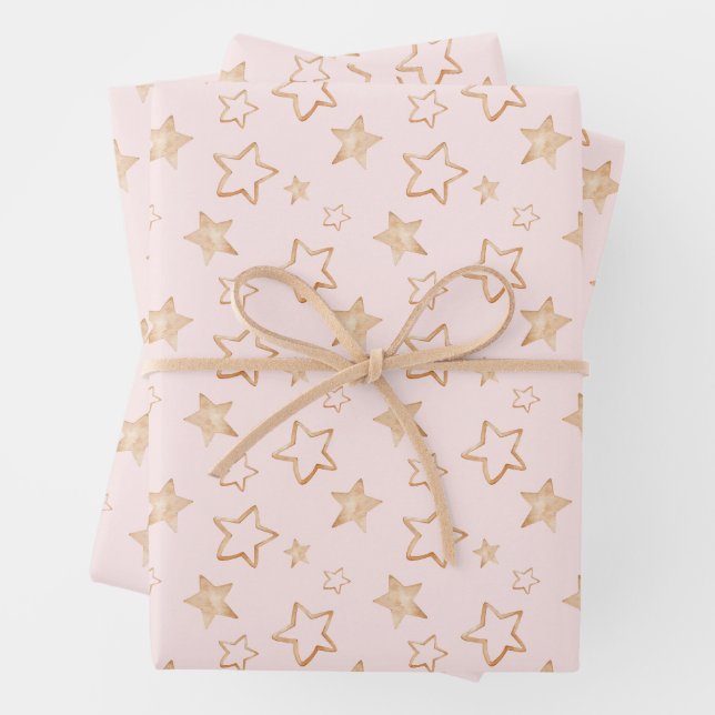 Feuille De Papier Cadeau Étoiles d'or sur rose (En situation)