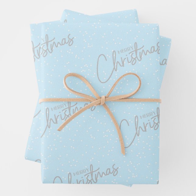 Feuille De Papier Cadeau Joyeux Noël avec Arrière - plan de neige bleue (En situation)