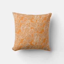 Feuilles blancs sur oreiller orange