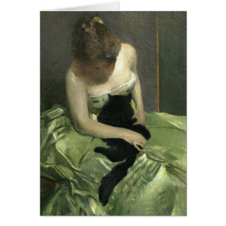 Fille dans la robe verte avec le chat noir