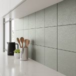 Fine Pebble Concrete Texture Sage ID1285 Fliese<br><div class="desc">This ceramic tile design features a detailed texture with fine pebbled markings reminiscent of sand-finished concrete, or a grainy stone effect. The elegant neutral, dusty sage color enhances the tile’s contemporary appeal while remaining highly versatile for a variety of interior styles including modern, industrial, minimalist, and Japandi-inspired spaces. Perfect for...</div>
