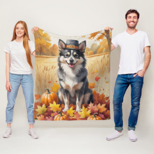 Finnisches Lapphund im Herbst lässt Erntedank Kuns Fleecedecke