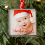 First Christmas Red Script Monogram Baby Foto Silbernes Ornament<br><div class="desc">Personalisieren Sie das erste Weihnachtsschmuck dieses Babys mit einem Foto,  seinen Vor- und Mittelnamen und seinem Geburtsjahr. Verwenden Sie "Anpassen",  um die rot-weißen Textfarben,  Schriftart und die Position zu ändern.</div>