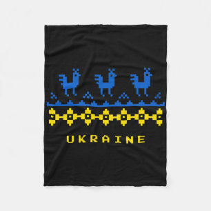 Flagge der Ukraine und traditionelles ukrainisches Fleecedecke
