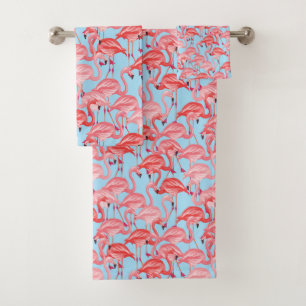 Flamants roses roses lumineux sur le bleu