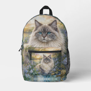 Flauschige Himalaya-Katze im lila Garten bei Sonne Bedruckter Rucksack