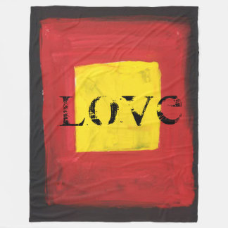 Fleece Blanket Schwarz, Rot und Gelb.
