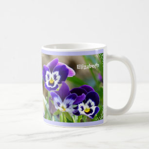 Fleur de pensée et tasse d'écriture sainte