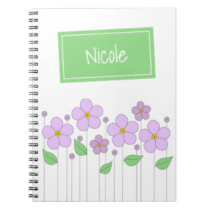 Fleurs et carnet lilas de photo d'étiquette