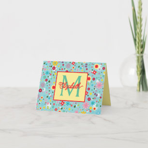 Fleurs printanières sur monogramme bleu aqua