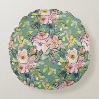 Fleurs roses sur coussin vert rond | Charme