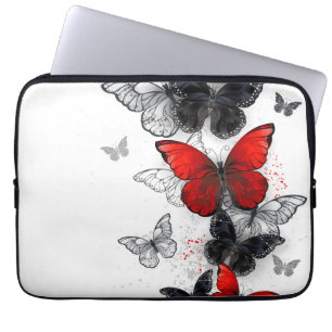 Fliegende schwarze und rote Morpho-Schmetterlinge Laptopschutzhülle