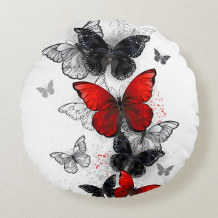 Fliegende schwarze und rote Morpho-Schmetterlinge Rundes Kissen