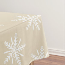 Flocons de neige blancs sur la nappe beige de Noël