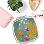 Floral Landschaft Gustav Klimt Taschenspiegel<br><div class="desc">Ein kompakter Spiegel mit dem Jugendstil-Gemälde von Gustav Klimt (1862-1918),  Blumengarten (c. 1906). Ein Garten voller bunter Petunien,  Aster und anderer Blume.</div>