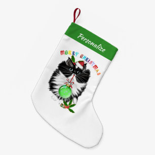 Fluffige schwarze und weiße Katze Weihnachtsmannmü Kleiner Weihnachtsstrumpf