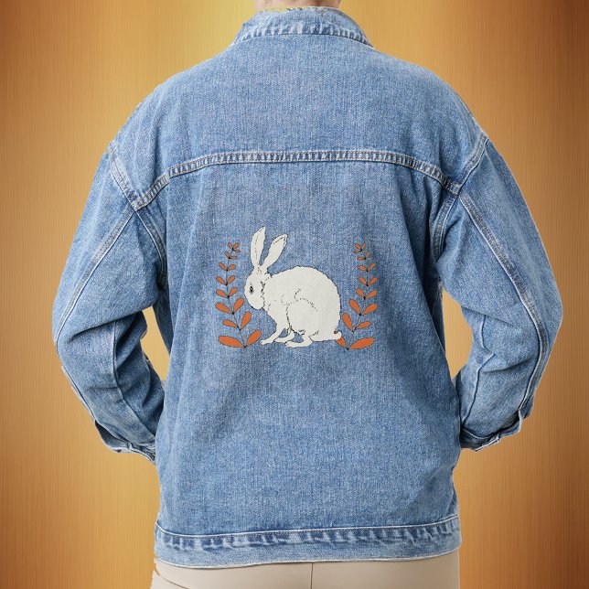 Fluffy assis Blanc Lapin Orange Plantes (Sitting white bunny with tall leafy orange plants on a denim jean jacket.)