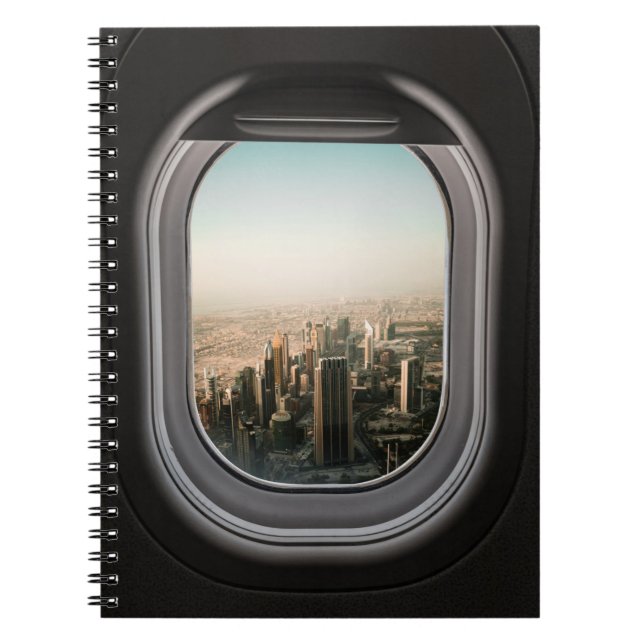 FLUGFENSTER MIT BLICK AUF DIE STADT WÄHREND DES TA NOTIZBLOCK (Vorderseite)