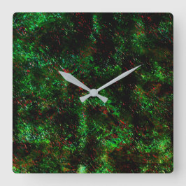 Fluktuation von dunklen Flecken auf leuchtend grün Quadratische Wanduhr