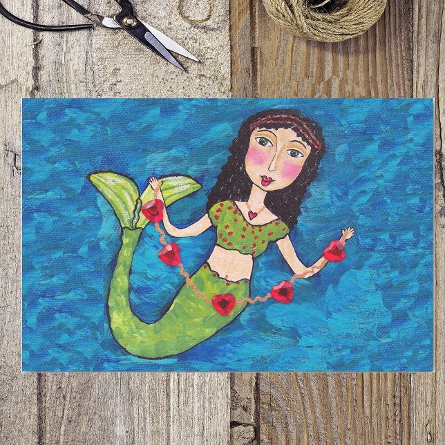 Folk Art Green Mermaid String von Red Hearts Seidenpapier (Green tailed mermaid holding string of red hearts on shades of blue wrapping tissue paper.)