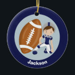 Football Boy Personalized Blue Kids Christmas Keramik Ornament<br><div class="desc">Cool customized football player ornament for someone who plays or watches football. This cute Christmas gift features a boy wearing a blue and silver football uniform crouched down next to a giant football. Personalize by adding a name in white on the blue back.</div>