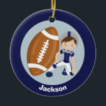 Football Boy Personalized Blue Kids Christmas Keramik Ornament<br><div class="desc">Cool customized football player ornament for someone who plays or watches football. This cute Christmas gift features a boy wearing a blue and silver football uniform crouched down next to a giant football. Personalize by adding a name in white on the blue back.</div>