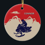 For Snowmobilers Snowmobile Graphic Personalized Keramik Ornament<br><div class="desc">Create a personalized gift for your favorite snowmobiler. This Christmas tree ornament has a vintage style illustration of a snowmobile and rider in navy blue set against a backdrop of cream or ivory colored mountains against a red background. It's ready to be personalized with a name in cream and blue...</div>