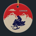 For Snowmobilers Snowmobile Graphic Personalized Keramik Ornament<br><div class="desc">Create a personalized gift for your favorite snowmobiler. This Christmas tree ornament has a vintage style illustration of a snowmobile and rider in navy blue set against a backdrop of cream or ivory colored mountains against a red background. It's ready to be personalized with a name in cream and blue...</div>