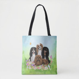 Four Cavalier King Charles Spaniels in Blume Tasche