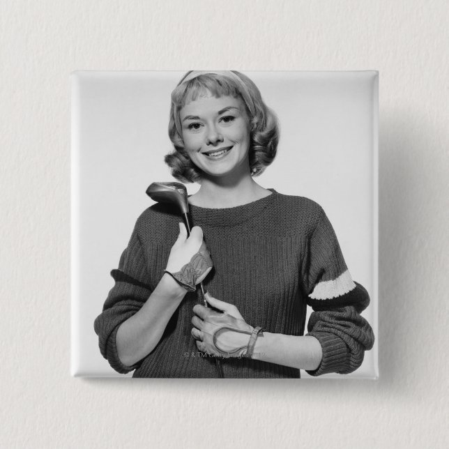 Frau, die Golfclub hält Button (Vorderseite)