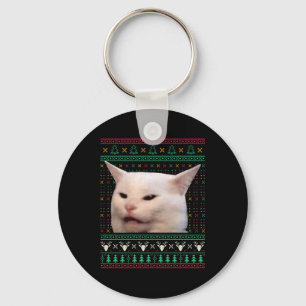Frauen schreien bei einer Katze, die zu Weihnachte Schlüsselanhänger