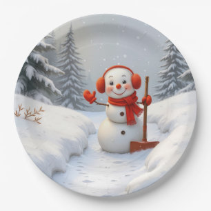 Freundlicher Schneemann mit einer roten Schaufel Pappteller