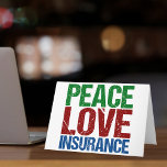 Friedenssicherung - Liebe Feiertagskarte<br><div class="desc">Eine niedliche Agent-Weihnachtsgeschenk mit grünen,  roten und blauen Buchstaben,  die Peace Liebe Insurance lesen. Gutes Geschenk für Ihre Mitarbeiter in der Versicherungsgesellschaft.</div>