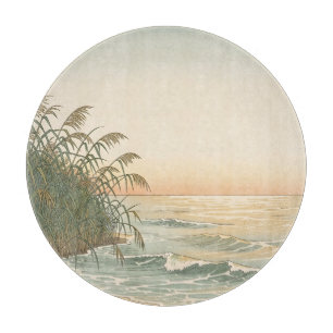 Friedliche Küstenrohre Sonnenuntergangsstrand Well Schneidebrett