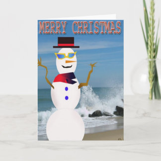 Frohe Weihnachten auf dem Schneemann am Strand
