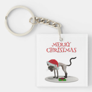 Frohe Weihnachten. Katze mit Weihnachtsmannmütze Schlüsselanhänger
