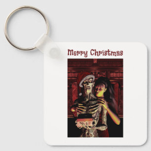 Frohe Weihnachten. Lustiges Skelett mit Frau Schlüsselanhänger